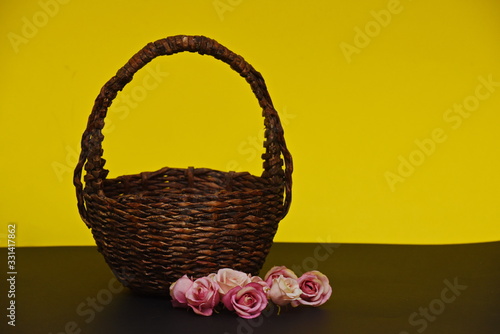 wicker brown basket and lined rose buds