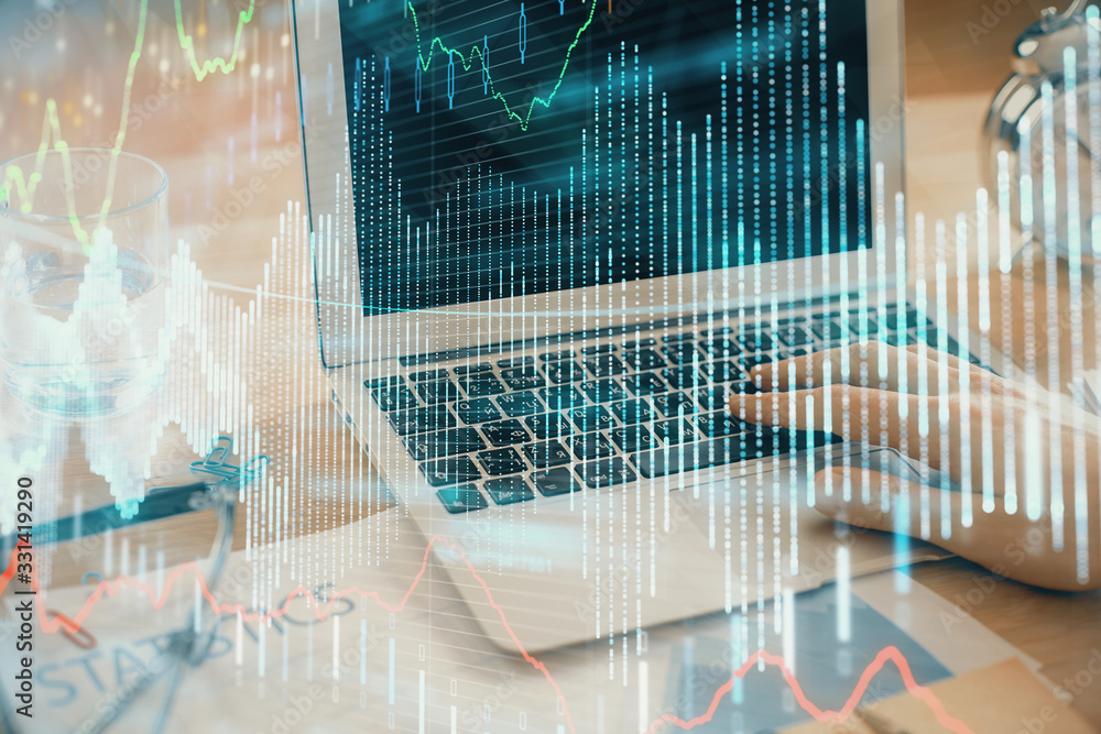 Multi exposure of market chart with man working on computer on background. Concept of financial analysis. Multi exposure of market chart with man working on computer on background. Concept of financial analysis.