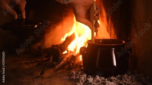 Meat cooked in the pignata on the fire4 photo