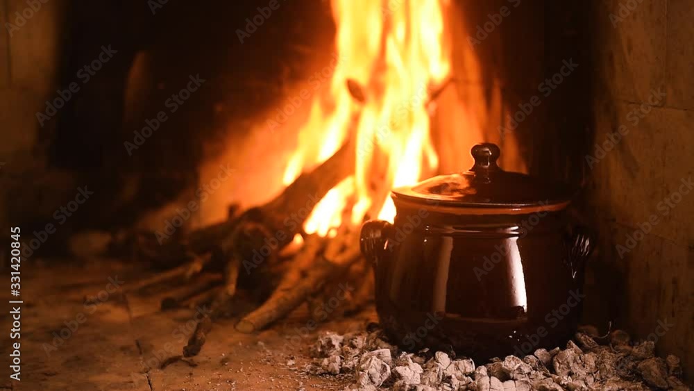 Meat cooked in the pignata on the fire 3 Meat cooked in the pignata on the fire 3