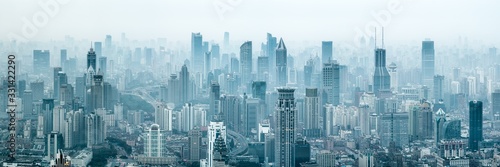 Panoramic view of the Shanghai skyline with skyscrapers covered in smog, China photo