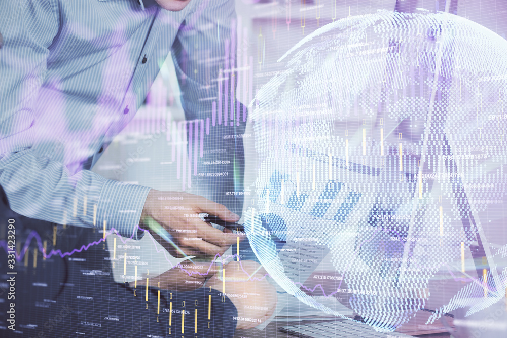 Double exposure of chart with businessman typing on computer in office on background. Concept of hard work. Double exposure of chart with businessman typing on computer in office on background. Concept of hard work.