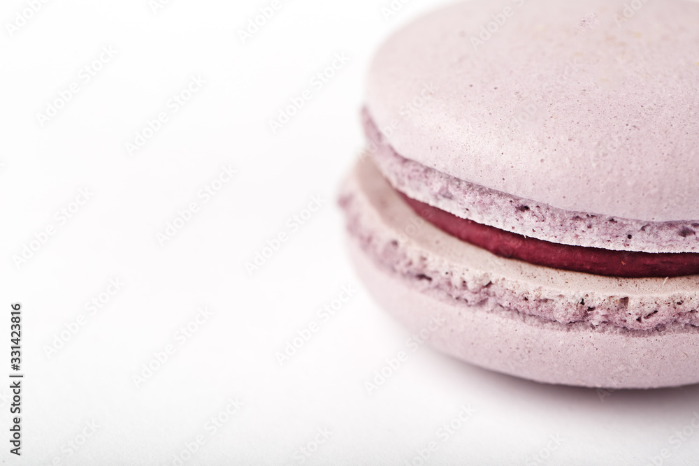 Lilac cookies macaroni on a white background of brown color with filling, isolated. Lilac cookies macaroni on a white background of brown color with filling, isolated.