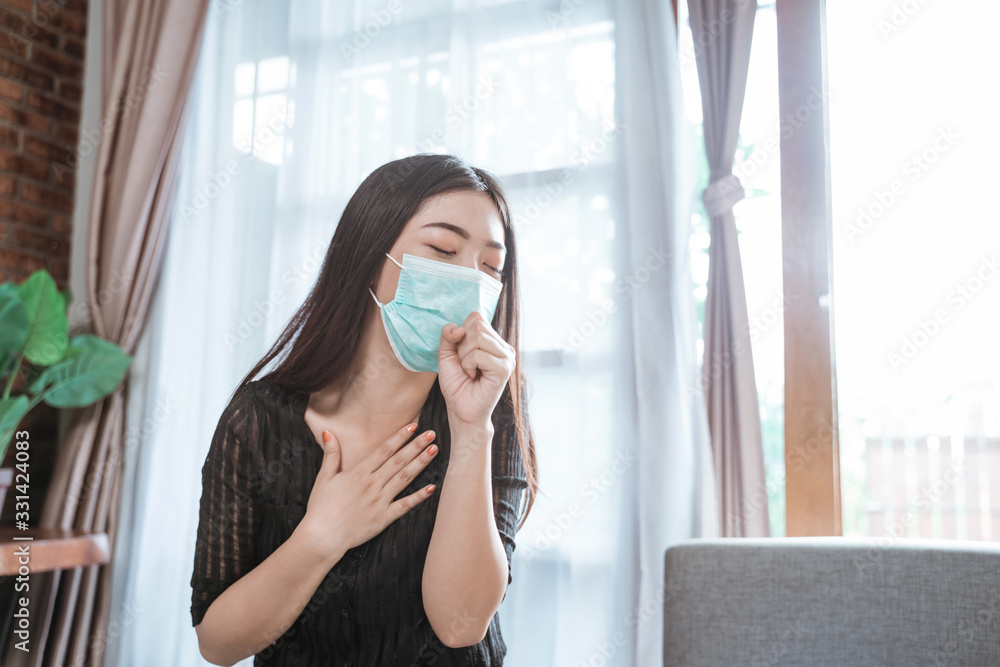 asian woman coughing at home wearing face masks asian woman coughing at home wearing face masks