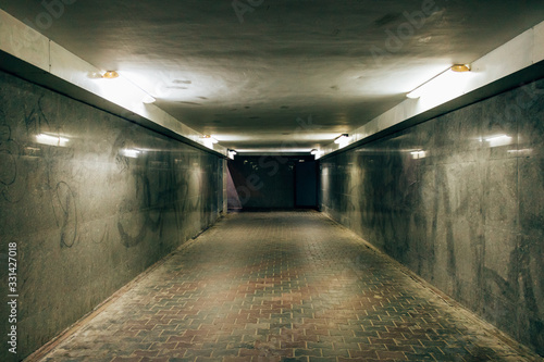 Illuminated empty underground tunnel