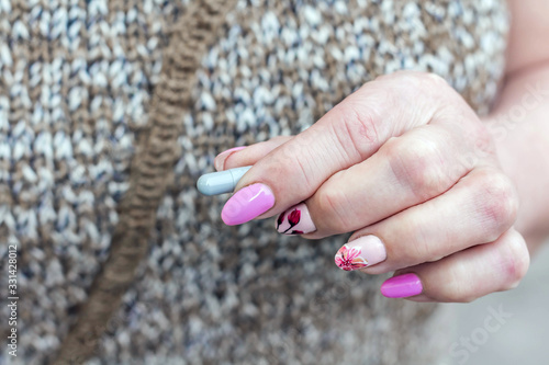 Senior woman holds pills in hands, hands with manicure. The concept of caring for the elderly