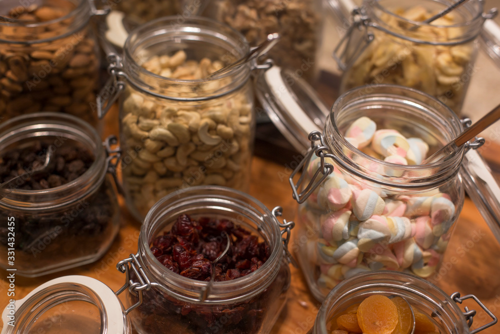 Healthy nuts in the glass bottle isolated Healthy nuts in the glass bottle isolated
