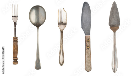 Vintage Silverware, antique spoons, forks, knives, cake shovels isolated on isolated white background. Antique silverware. Retro.