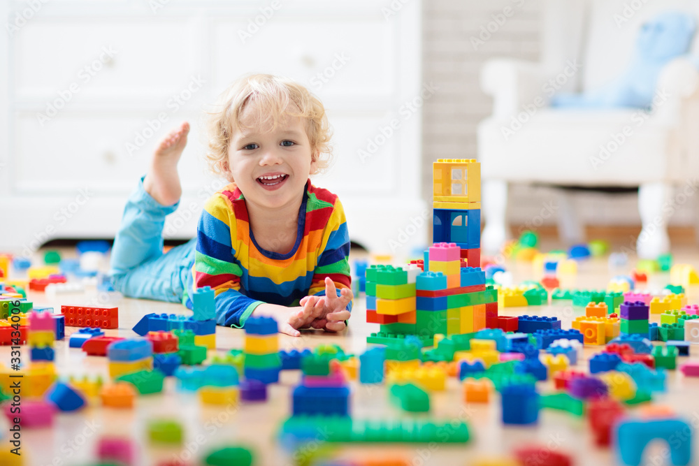 Child playing with toy blocks. Toys for kids. Child playing with toy blocks. Toys for kids.