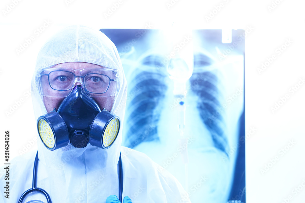 coronavirus or covid-19 concept,Male doctor in a protective suit Giving medicines to patients in the hospital.Lung X-ray Film Destruction Background.shallow focus effect. coronavirus or covid-19 concept,Male doctor in a protective suit Giving medicines to patients in the hospital.Lung X-ray Film Destruction Background.shallow focus effect.