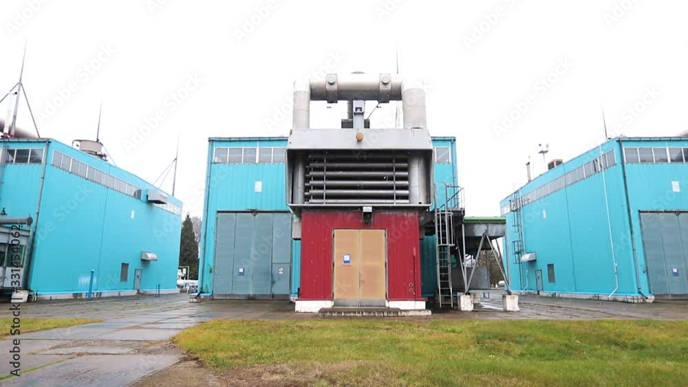 A modern facility with pipes or a powerful technological area. Gas technical complex for processing and supply. snow flies A modern facility with pipes or a powerful technological area. Gas technical complex for processing and supply. snow flies