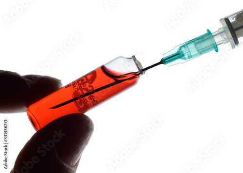 Vial and Syringe, preparing for an injection of hydroxocobalamin photo