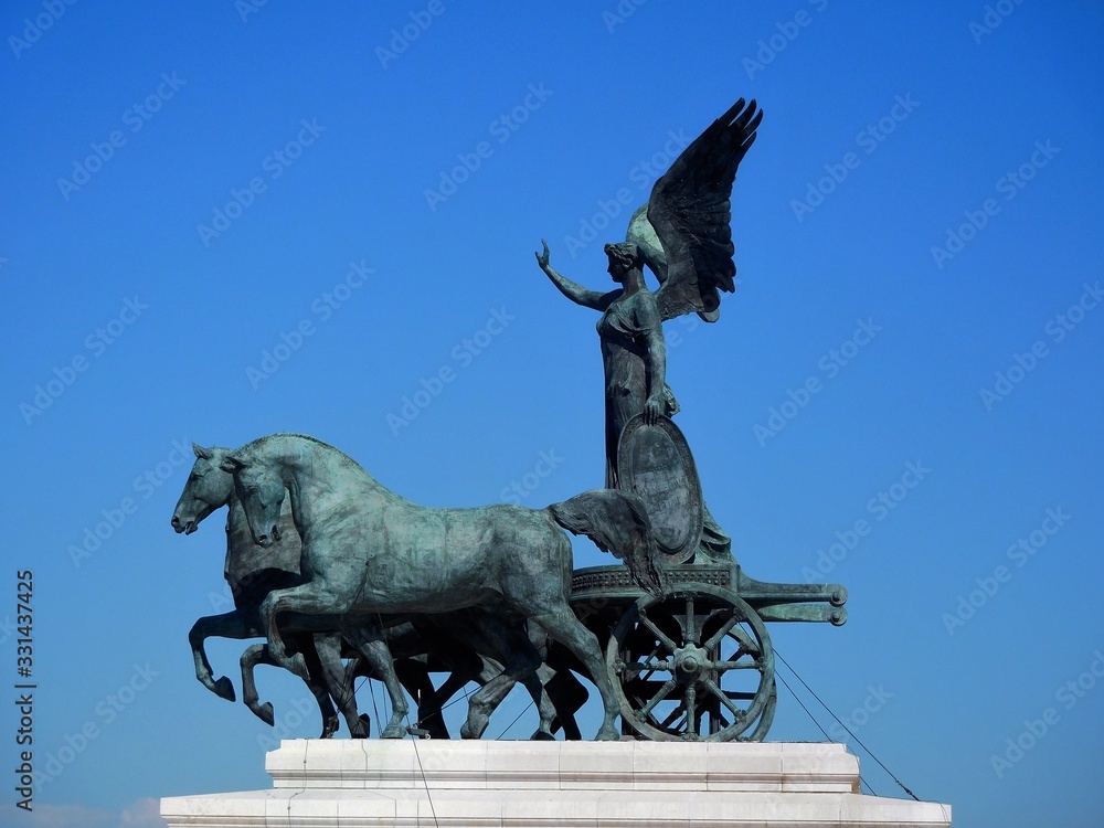 Statue in Rome, Italy against clear blue summer sky
