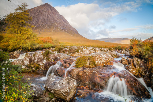 Small waterfall with Buachaille Etive Mor  mountain in Glencoe