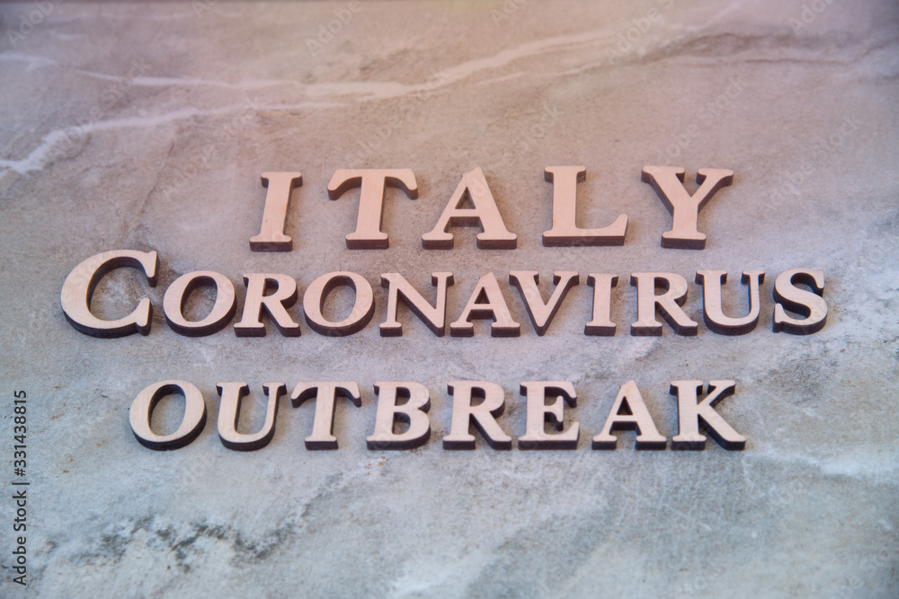 Italy coronavirus outbreak word written on wooden letters.