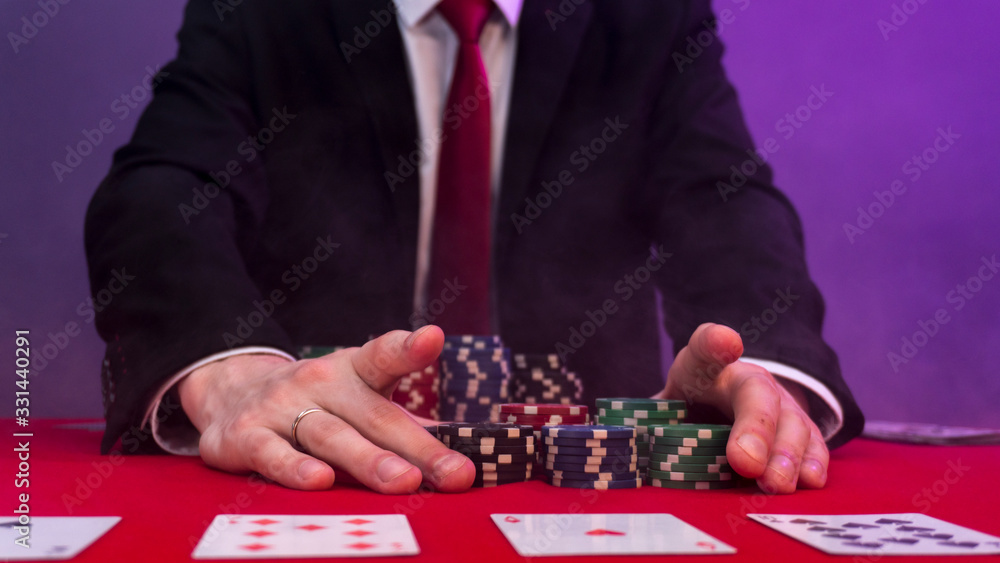man is sitting at the poker table. poker game. man is sitting at the poker table. poker game.