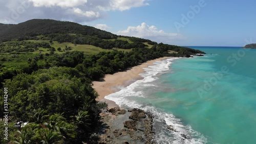 Guadeloupe sandy beach aerial drone view. Caribbean vacation landscape. Clugny beach (Plage de Clugny). photo