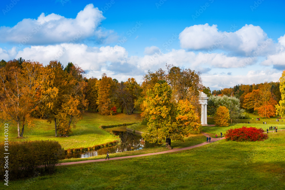 Temple of Friendship on bank of Slavyanka River in colorful autumn. Pavlovsk. Russia Temple of Friendship on bank of Slavyanka River in colorful autumn. Pavlovsk. Russia