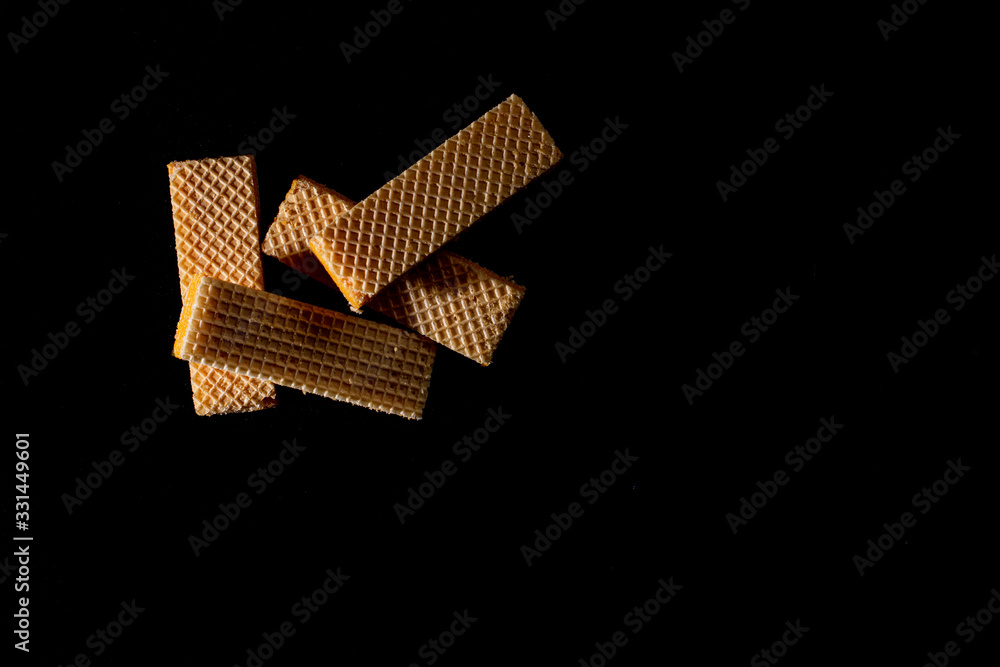 Top view four wafer on black background with copy space. Top view four wafer on black background with copy space.