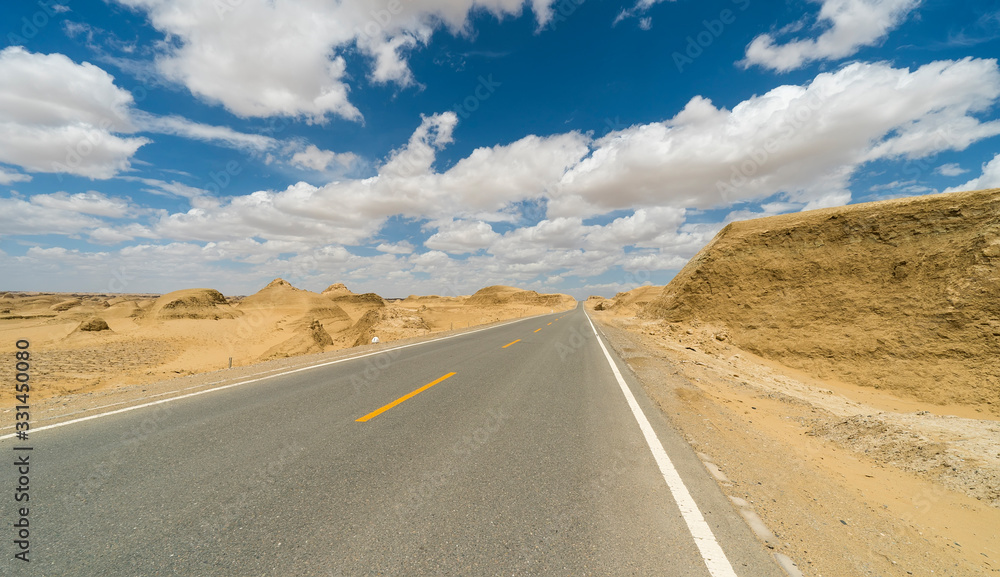 Fototapeta premium Road straight ahead to desert
