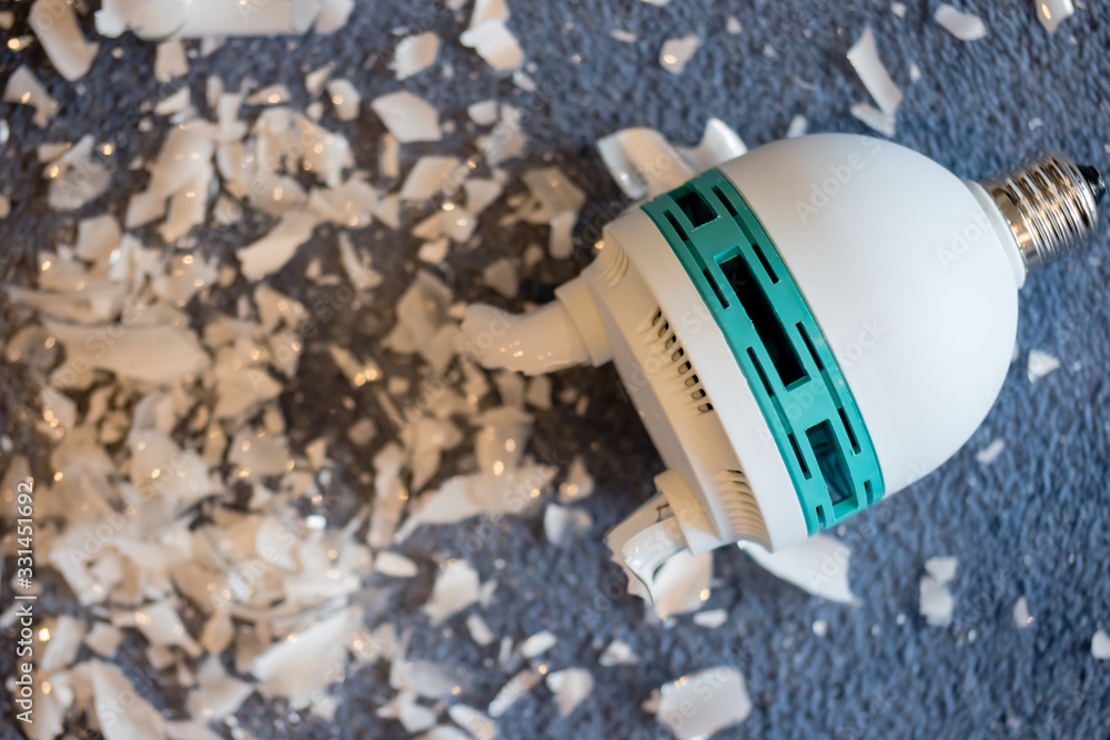A broken photographer's studio light - compact fluorescent lamp or CFL bulb - which has released mercury vapour A broken photographer's studio light - compact fluorescent lamp or CFL bulb - which has released mercury vapour