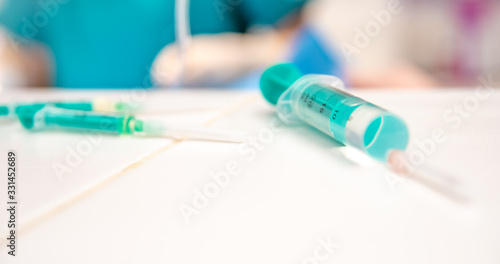 syringes ready for vaccination in hospital. administering drug to veins and soft tissues