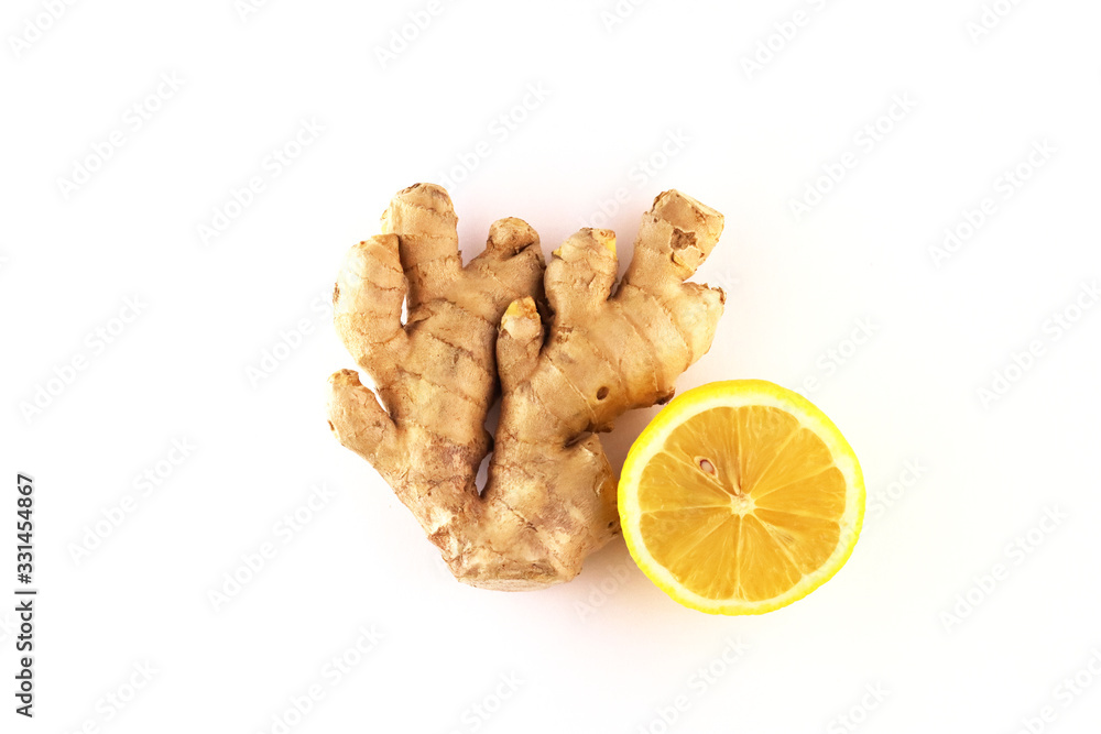 ginger root with lemon on a white background ginger root with lemon on a white background