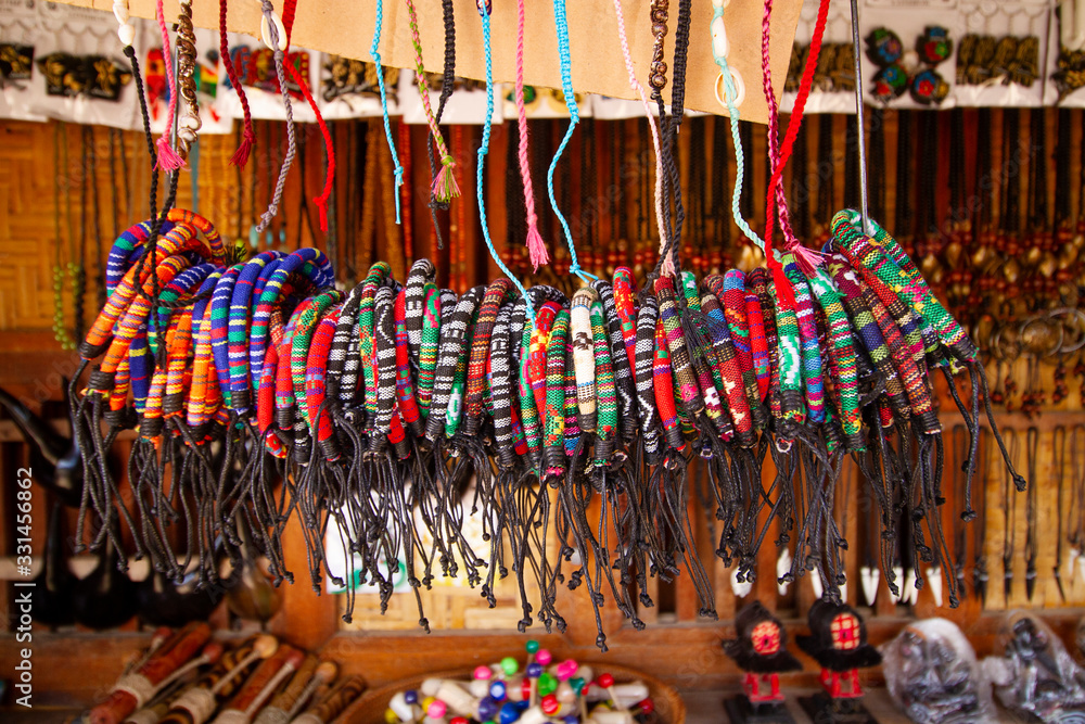 Obraz premium Ethnic Woven Bracelet With Vibrant Color Hanging In Store For Sale In Market