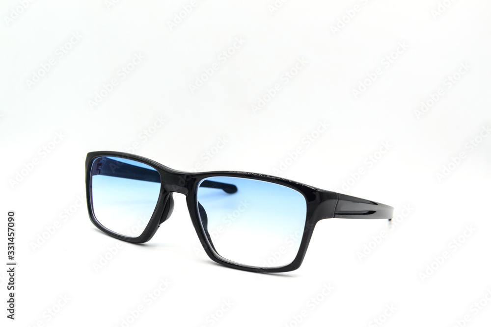 Stylish black glasses with blue tinted lens isolated on white background. Stylish black glasses with blue tinted lens isolated on white background.