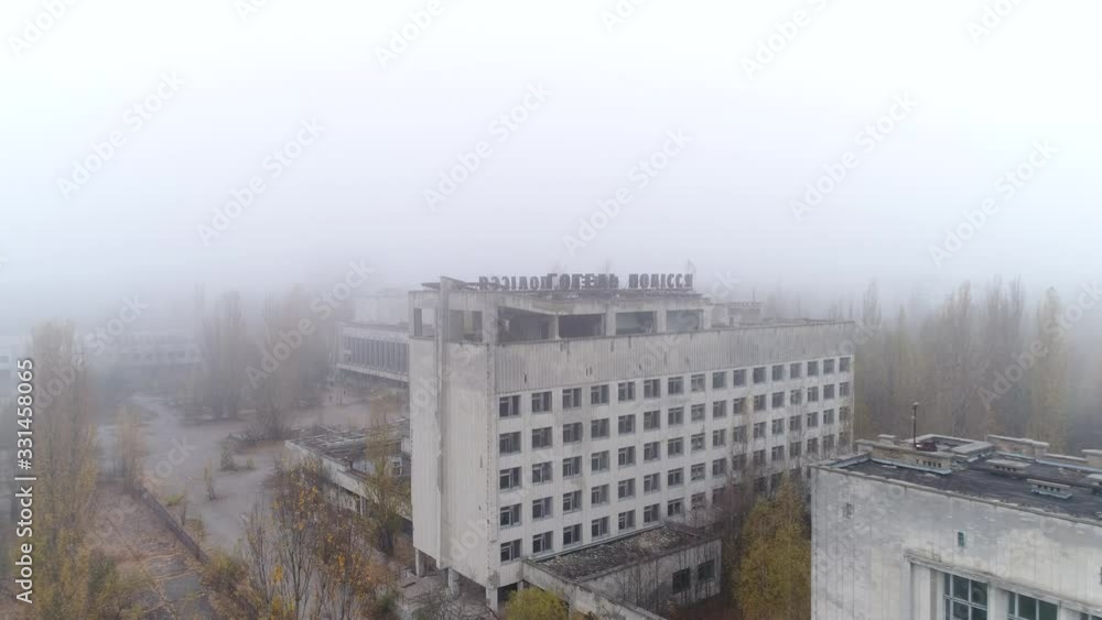 Video from a drone in an abandoned city of Pripyat in the Chernobyl exclusion zone. Hotel woodland. Palace of Culture Energetik in fog Video from a drone in an abandoned city of Pripyat in the Chernobyl exclusion zone. Hotel woodland. Palace of Culture Energetik in fog