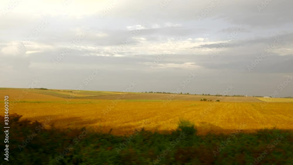 View From Train Car Wagon Opened Window. Traveling by Railway Across Europe. Trees Fields Village Evening Landscape. Summer Autumn Season, View From Train Car Wagon Opened Window. Traveling by Railway Across Europe. Trees Fields Village Evening Landscape. Summer Autumn Season,