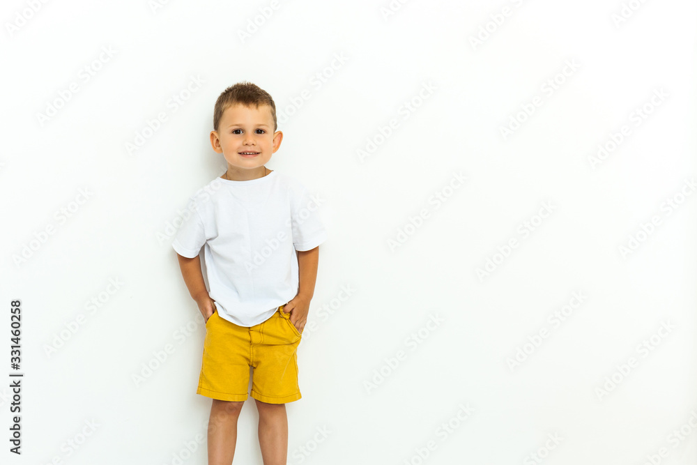 Cute little boy in yellow shorts and white t-shirt Cute little boy in yellow shorts and white t-shirt
