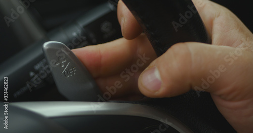 Gear levers in the steering wheel of a modern car. Paddle shift, car interior.
