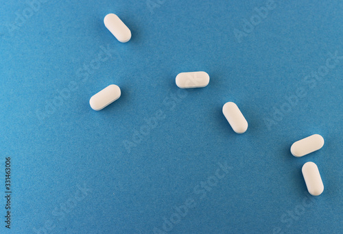 white tablets on a blue background