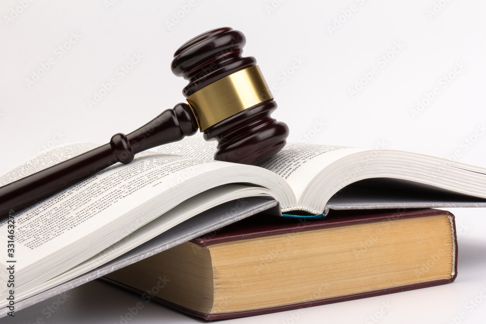 Wooden judges gavel on gray background in close up. Space for text Wooden judges gavel on gray background in close up. Space for text