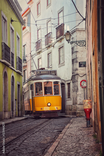 Old vintage tram in a narrow street of Lisbon, Portugal