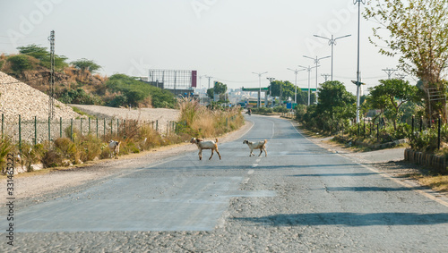 Mangla Road unidentified People ride motorcycle and car on the local roads photo