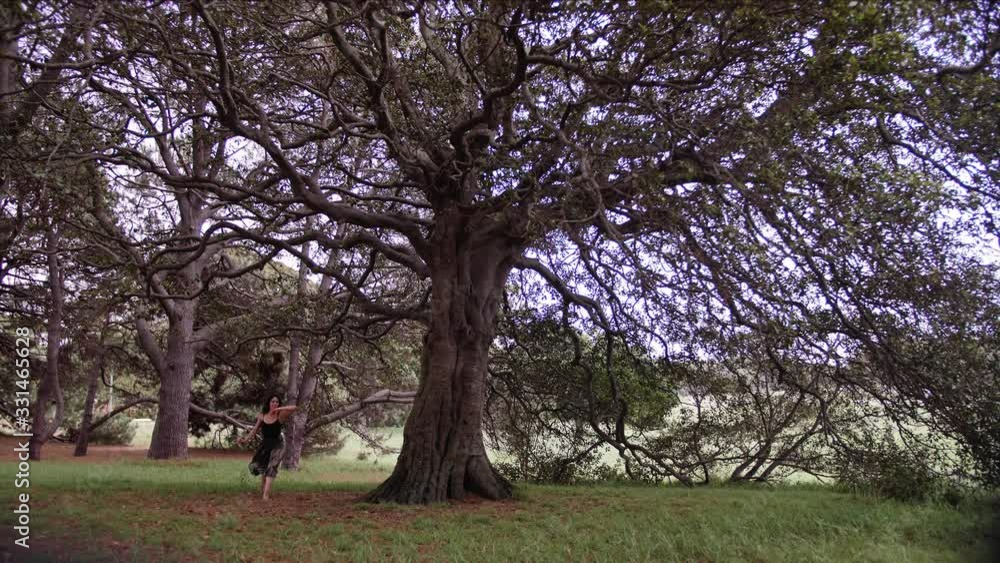 A Barefooted Ballerina Showing A Tour Jeté And A Grand Jeté For Finale On The Woods. -wide shot A Barefooted Ballerina Showing A Tour Jeté And A Grand Jeté For Finale On The Woods. -wide shot
