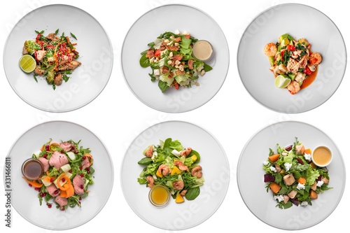 Set of delicious dietary, vitamin, healthy salads. Fitness nutrition. Banquet dishes. Isolated on a white background.