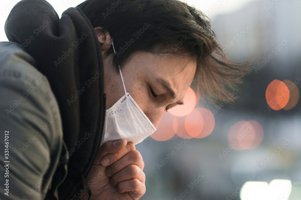 Plakat Side view of sick man with medical mask coughing