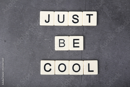 Inspirational sentence formed with game tiles Just be Cool  © nastyakamysheva