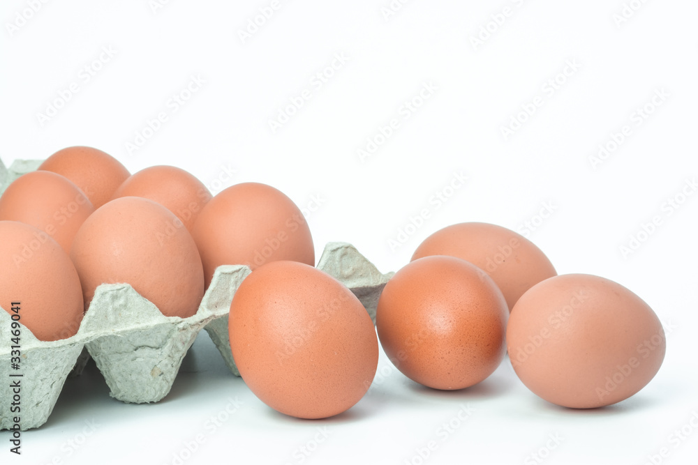 Chicken eggs in box on white background Chicken eggs in box on white background