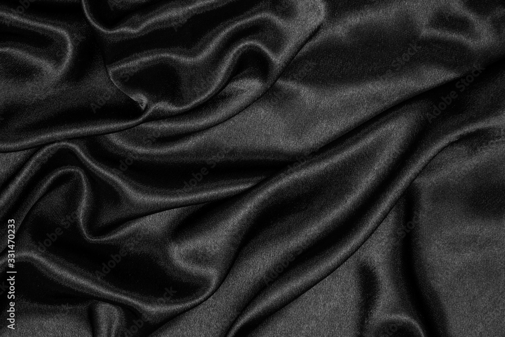 Smooth elegant black silk or satin luxury cloth texture can be used as abstract background. Crumpled fabric. Smooth elegant black silk or satin luxury cloth texture can be used as abstract background. Crumpled fabric.