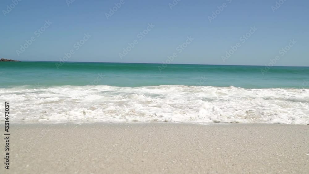 Slow Motion of Breaking Waves on Beach Flowing Directly to the Camera Slow Motion of Breaking Waves on Beach Flowing Directly to the Camera