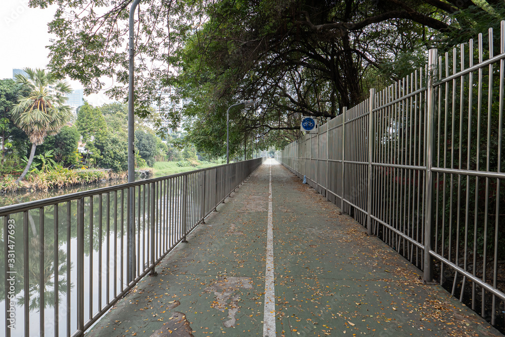 Bicycle lane between Benjakiti Park and Lumphini Park in Bangkok, Thailand Bicycle lane between Benjakiti Park and Lumphini Park in Bangkok, Thailand