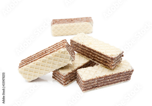 Crispy wafers with creamy hazelnut filling isolated on white background