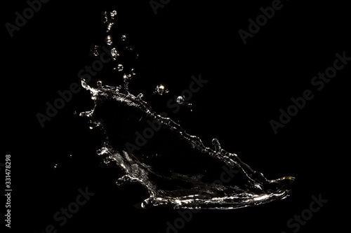 Splash water, clear clean water, isolated on a black background.