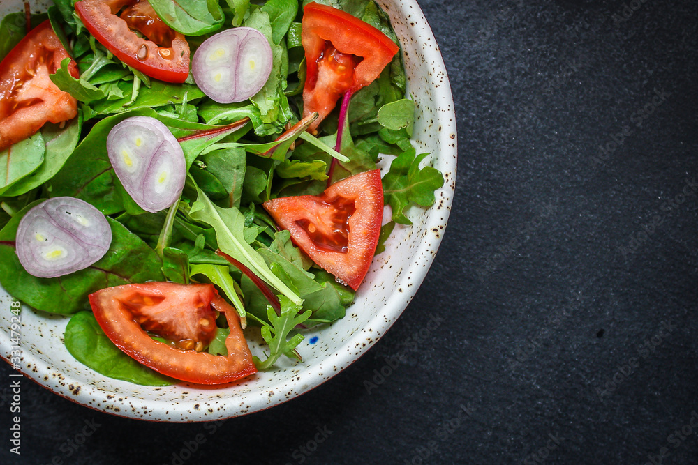 healthy salad tomato, mix leaves, onions and other ingredients, vegan, keto or paleo menu concept. top food background. copy space for text healthy salad tomato, mix leaves, onions and other ingredients, vegan, keto or paleo menu concept. top food background. copy space for text