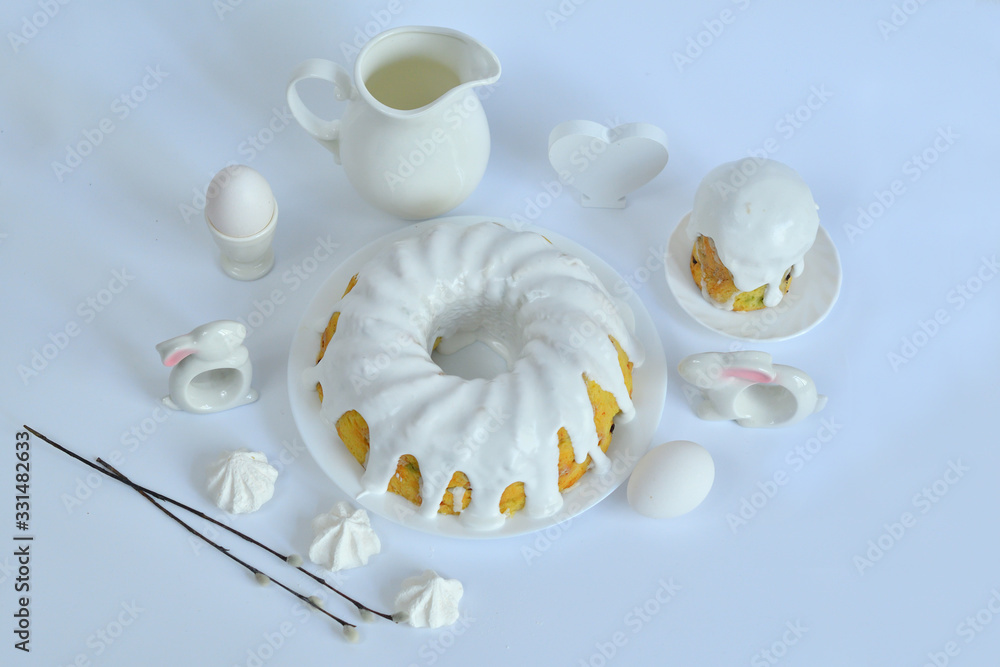 Fototapeta premium Festive Easter spring composition with pussy willow branches with catkins and multicolored eggs.Easter Background. Springtime. Invitation card design with copy space. Easter card template.