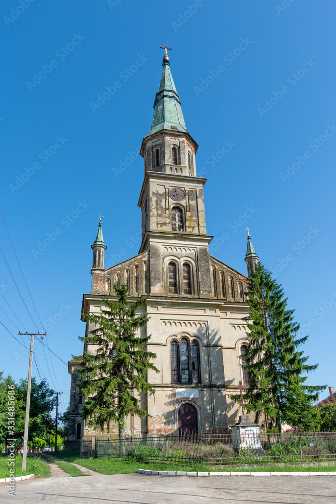 Ecka, Serbia - June 30, 2019: St. Jovan the Baptist Catholic Church in Ečka, Serbia. It was erected in 1864 on the site of the old church from 1794.